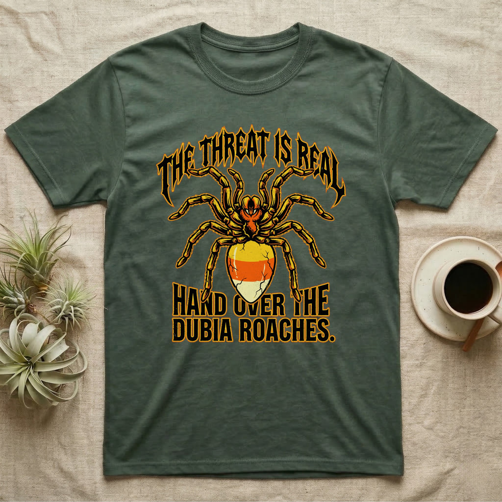 Tarantula Threat Dubia Roaches T-Shirt in Military Green — Metal-style tarantula in threat posture with a candy-corn abdomen, "The Threat Is Real, Hand Over the Dubia Roaches."