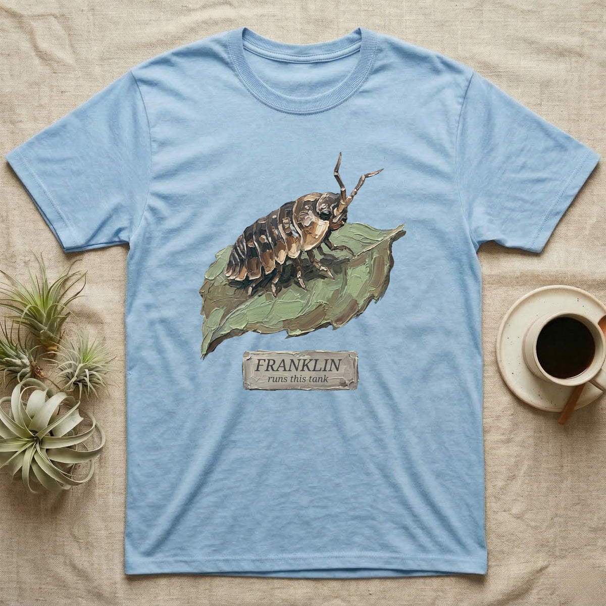 Franklin Isopod Tank T-Shirt in Light Blue — Impasto oil-painting portrait of an isopod on a leaf with an engraved Franklin name-plate beneath the subject.