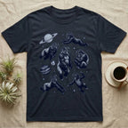 Gorillas in space float among planets and stars, on a dark t-shirt.