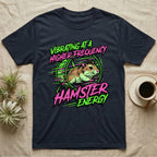 Dark t-shirt with neon green and pink graphic of a hamster running in a wheel with text "VIBRATING AT A HIGHER ENERGY HAMSTER ENERGY".