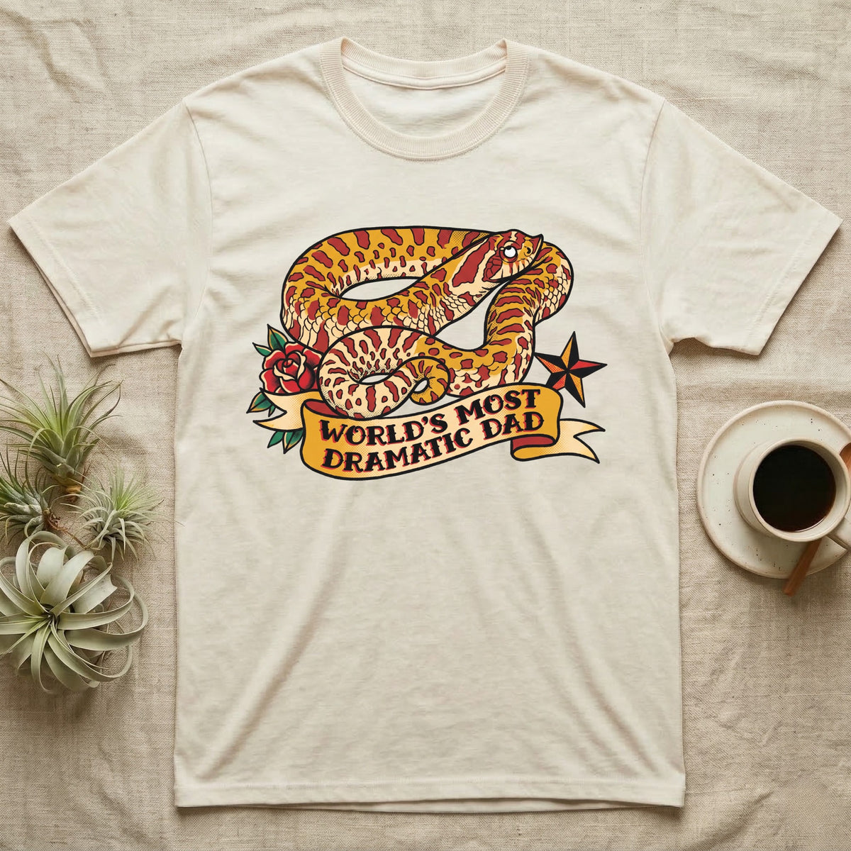 Dramatic Dad Hognose T-Shirt in Natural — Tattoo-flash illustration of a hognose snake mid-dramatic-flop with a banner reading World's Most Dramatic Dad.