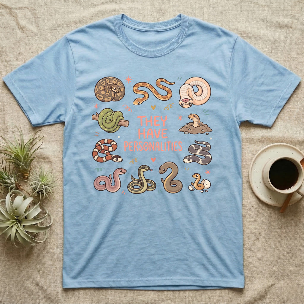 Snake Keeper Personalities T-Shirt in Light Blue — Outline illustration of five snakes in different postures scattered around hand-lettered script on grey.
