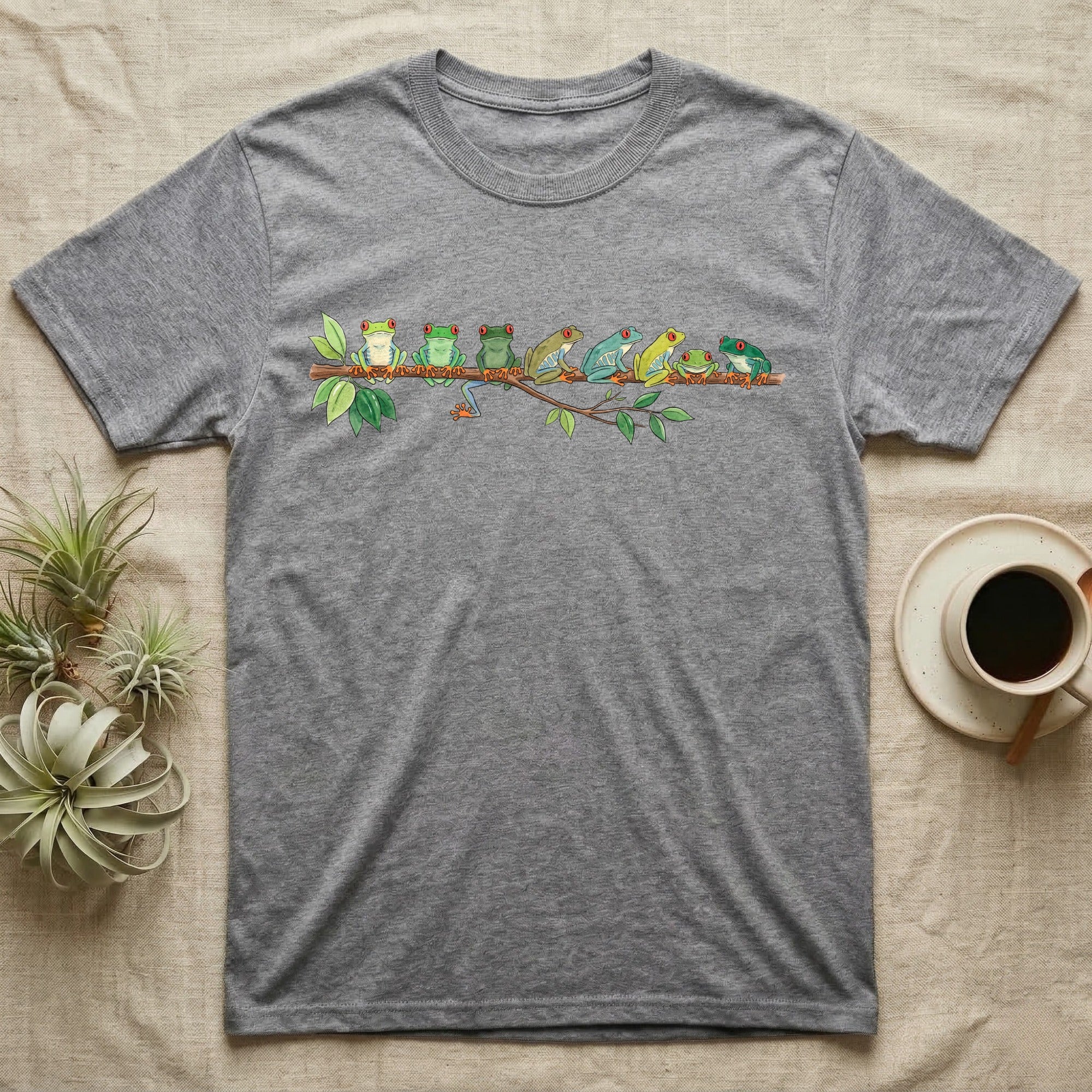 Red-Eyed Tree Frog Canopy Crew T-Shirt in Sport Grey — Watercolor illustration of seven red-eyed tree frogs in varied green hues on a branch, dark grey T-shirt design.