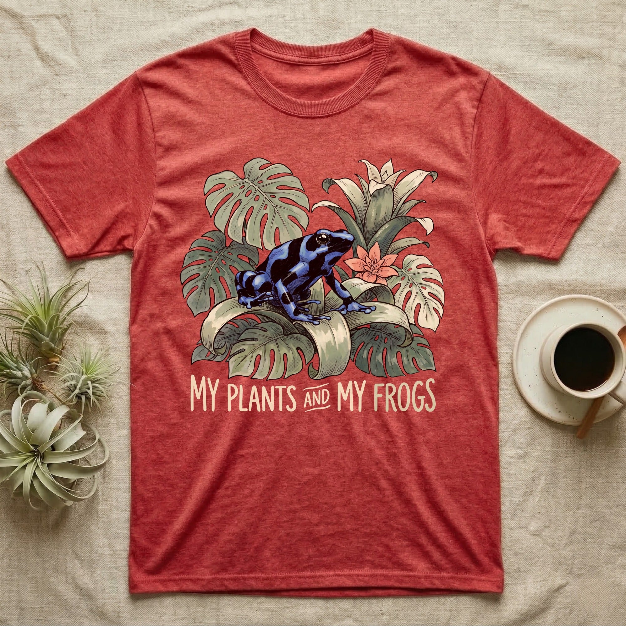 Plants And Frogs T-Shirt in Heather Red — Naturalist-plate illustration of a dart frog perched in lush foliage with hand-lettered text reading My Plants And My Frogs.