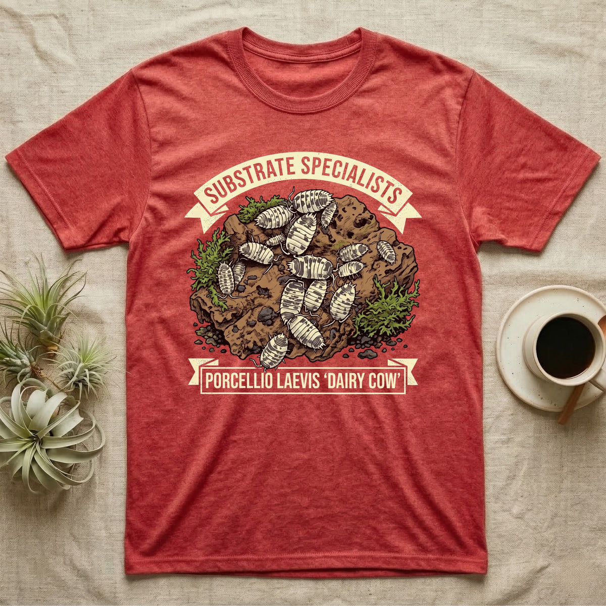 Dairy Cow Isopod Substrate Specialists T-Shirt in Heather Red — Vintage print of a dairy cow isopod colony on a mossy soil clod between "Substrate Specialists" banners.