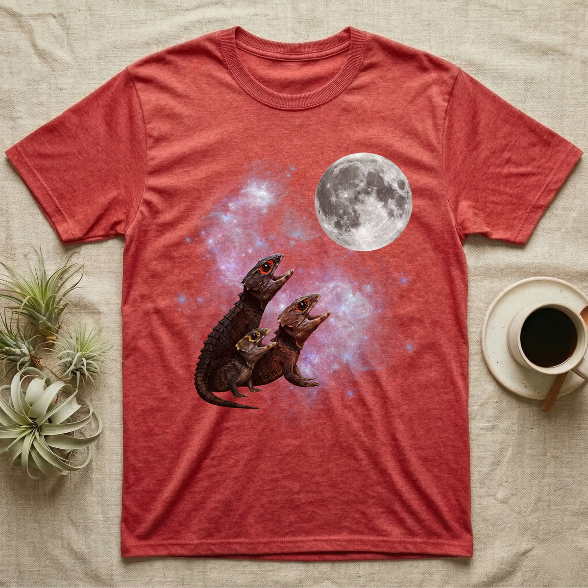 Red-Eyed Crocodile Skink Moon Howl T-Shirt in Heather Red — Three Red-Eyed Crocodile Skink colour morphs howling at a full moon over a nebula on a dark grey t-shirt.