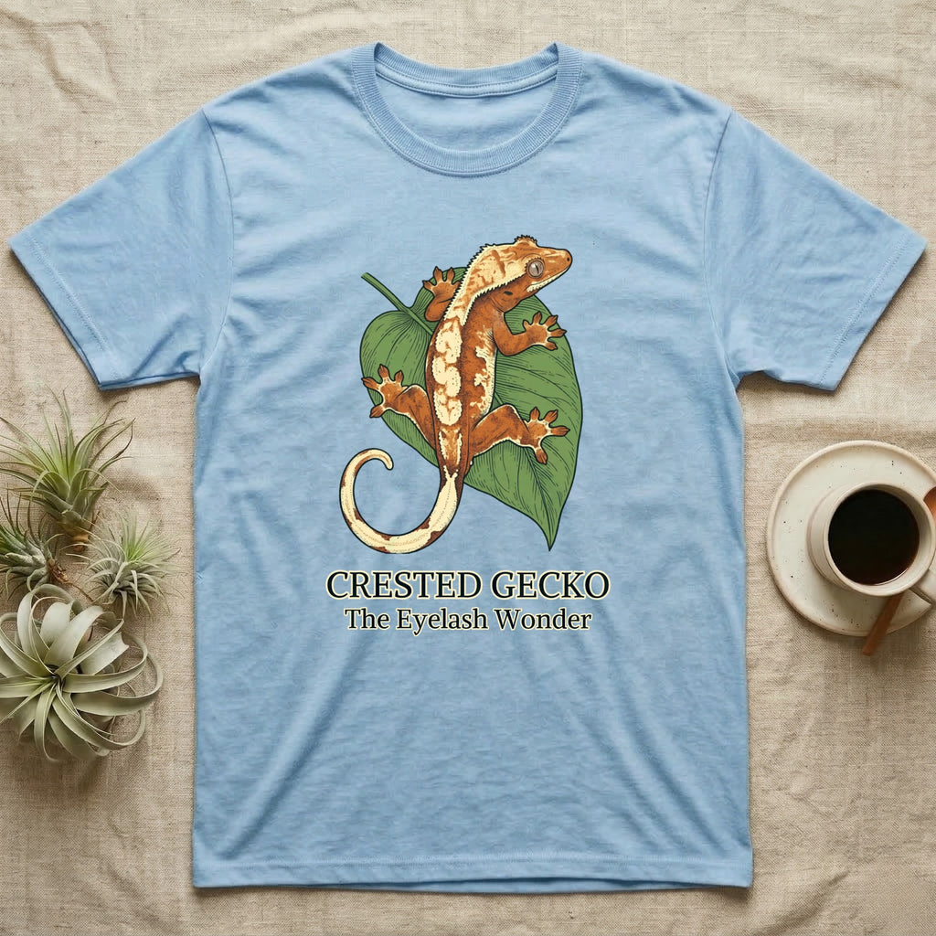 Light blue t-shirt featuring a crested gecko on a green leaf.