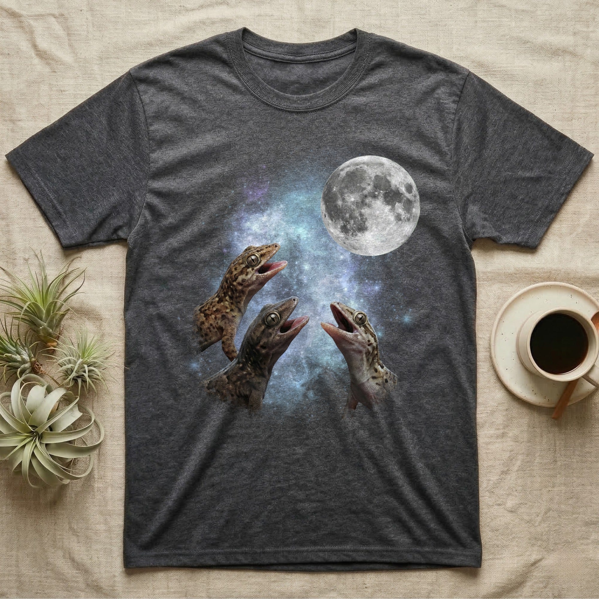 Mourning Gecko Moon Howl T-Shirt in Dark Heather — Three Mourning Gecko colour morphs howling at a full moon over a nebula on a dark grey t-shirt.