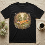 Black t-shirt with graphic of a gecko surrounded by plants and mushrooms.