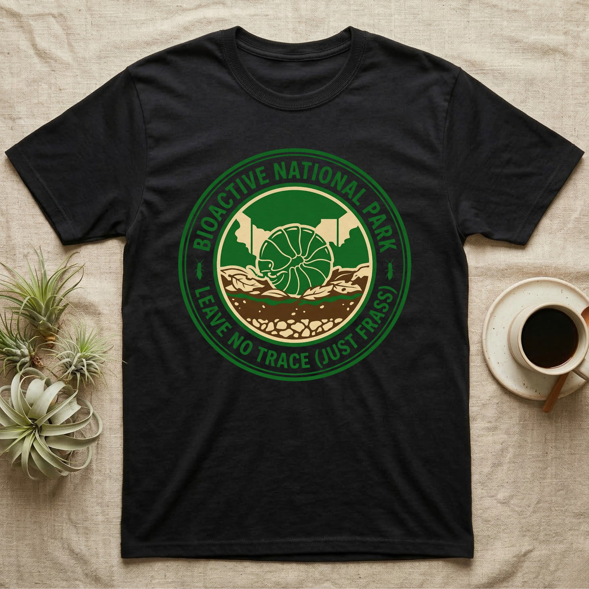 Pillbug Bioactive National Park T-Shirt in Black — Green ranger badge with a rolled pillbug in a cross-sectioned bioactive enclosure and springtail stars.
