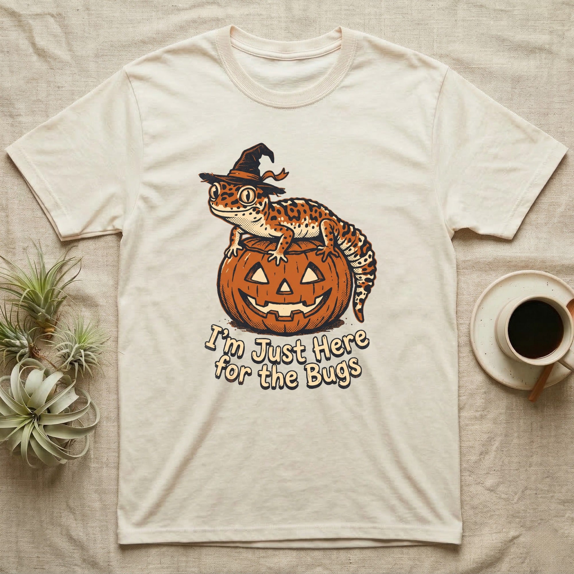 Leopard Gecko Here For Bugs T-Shirt in Natural — Vintage cartoon leopard gecko in a witch hat on a jack-o'-lantern, "I'm Just Here for the Bugs."