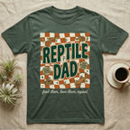 Green t-shirt with "Reptile Dad" graphic, scales, and snake illustrations.