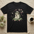 Black t-shirt with a hedgehog wearing a straw hat among cherry blossoms.