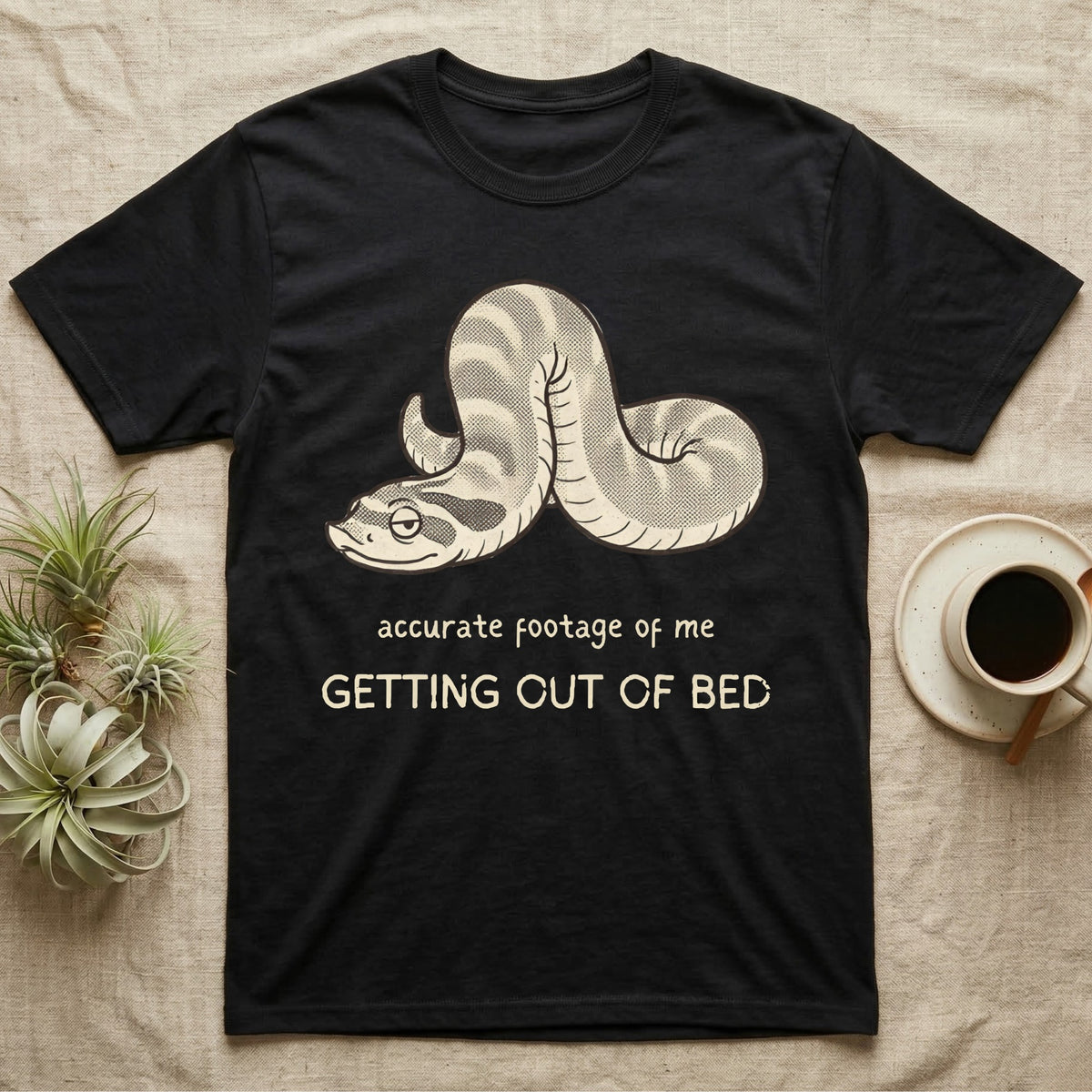 Hognose Morning Mood T-Shirt in Black — Retro-illustration of a hognose snake flopped limp with hand-drawn marker text about getting out of bed.