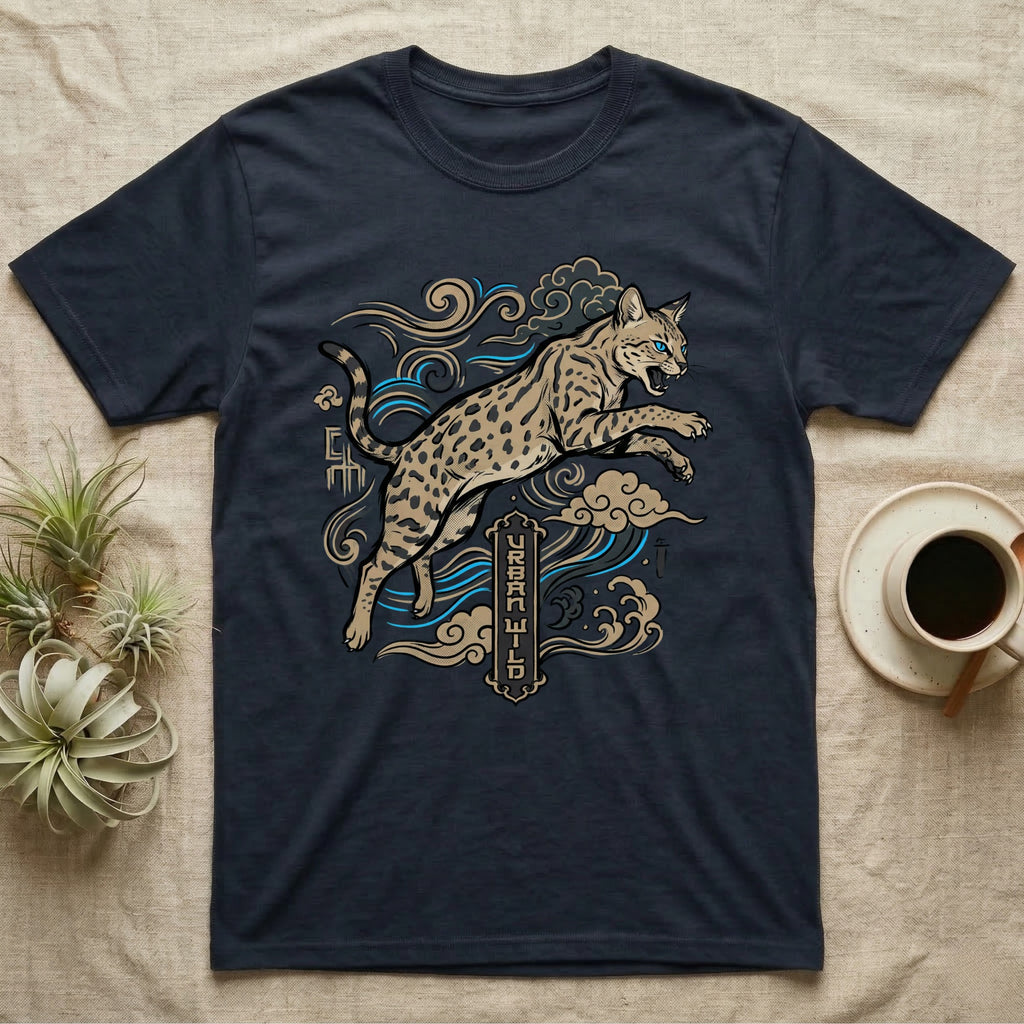 Dark t-shirt with a leaping spotted cat, clouds, and "URBAN WILD" text.