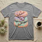 T-shirt featuring a stacked illustration of colorful pastel snakes.
