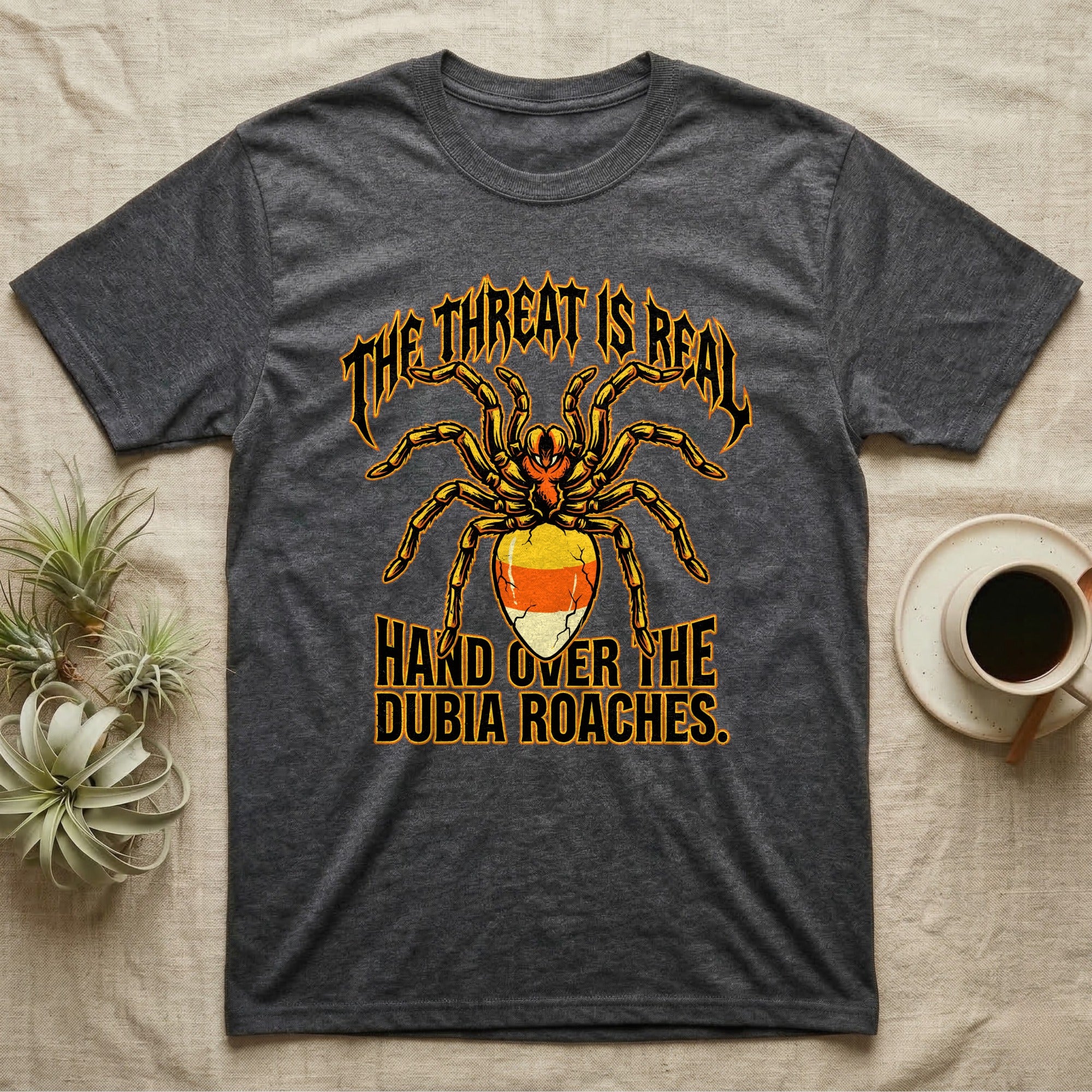 Tarantula Threat Dubia Roaches T-Shirt in Dark Heather — Metal-style tarantula in threat posture with a candy-corn abdomen, "The Threat Is Real, Hand Over the Dubia Roaches."