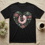 Black t-shirt with a heart-shaped axolotl design surrounded by flowers and leaves.