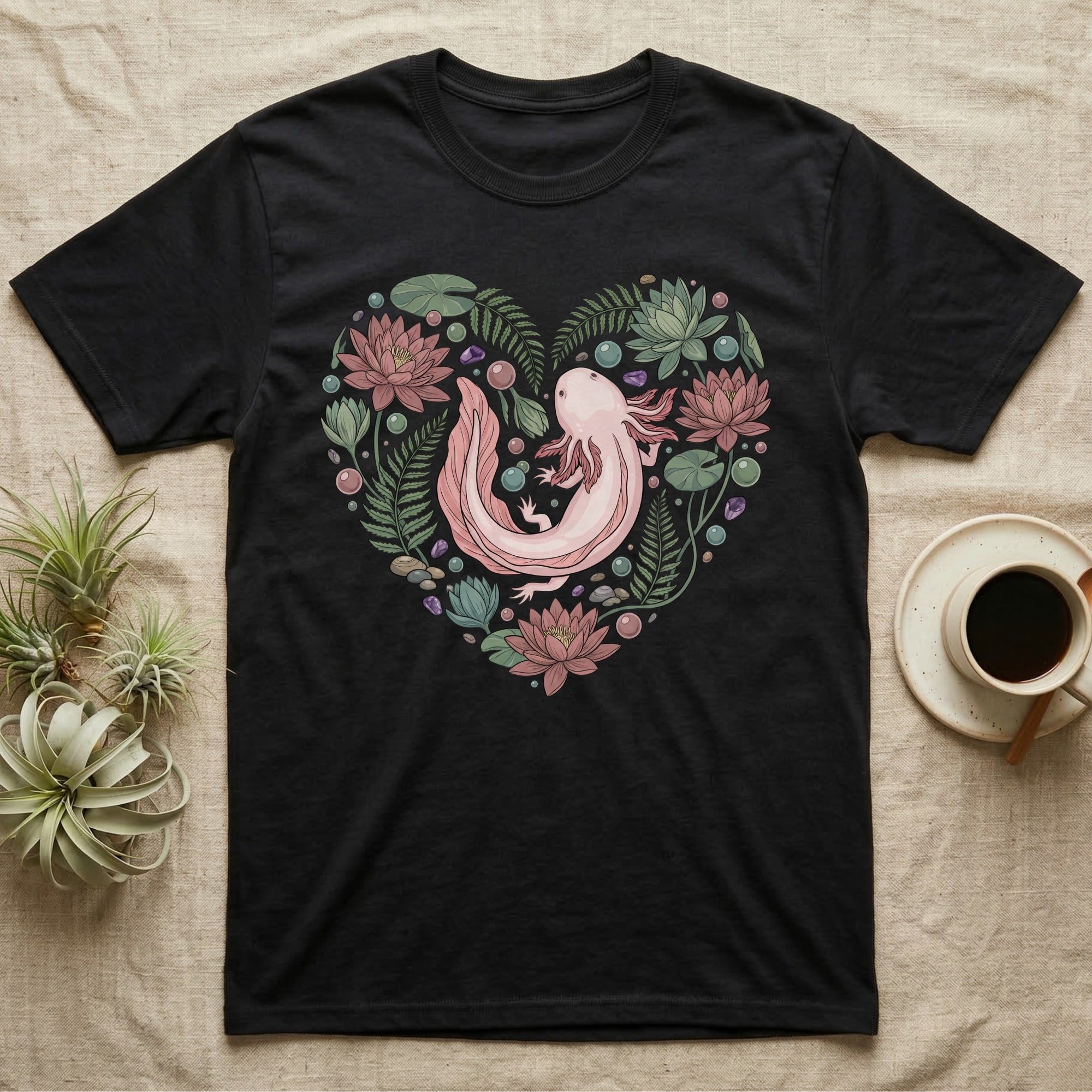 Black t-shirt with a heart-shaped axolotl design surrounded by flowers and leaves.