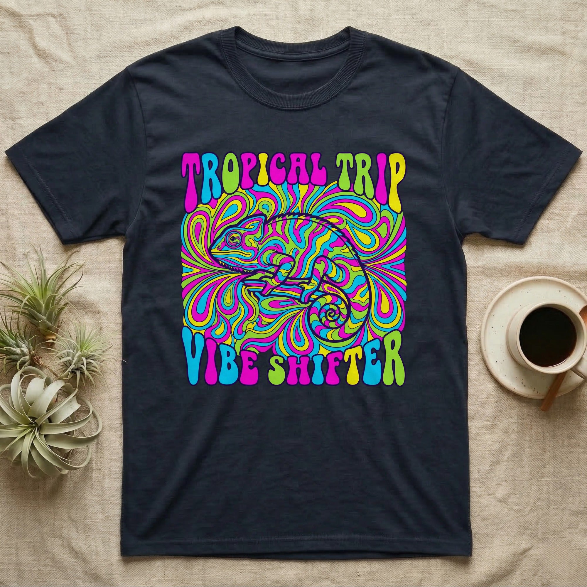 Black t-shirt with psychedelic chameleon and "TROPICAL TRIP VIBE SHIFTER" text.