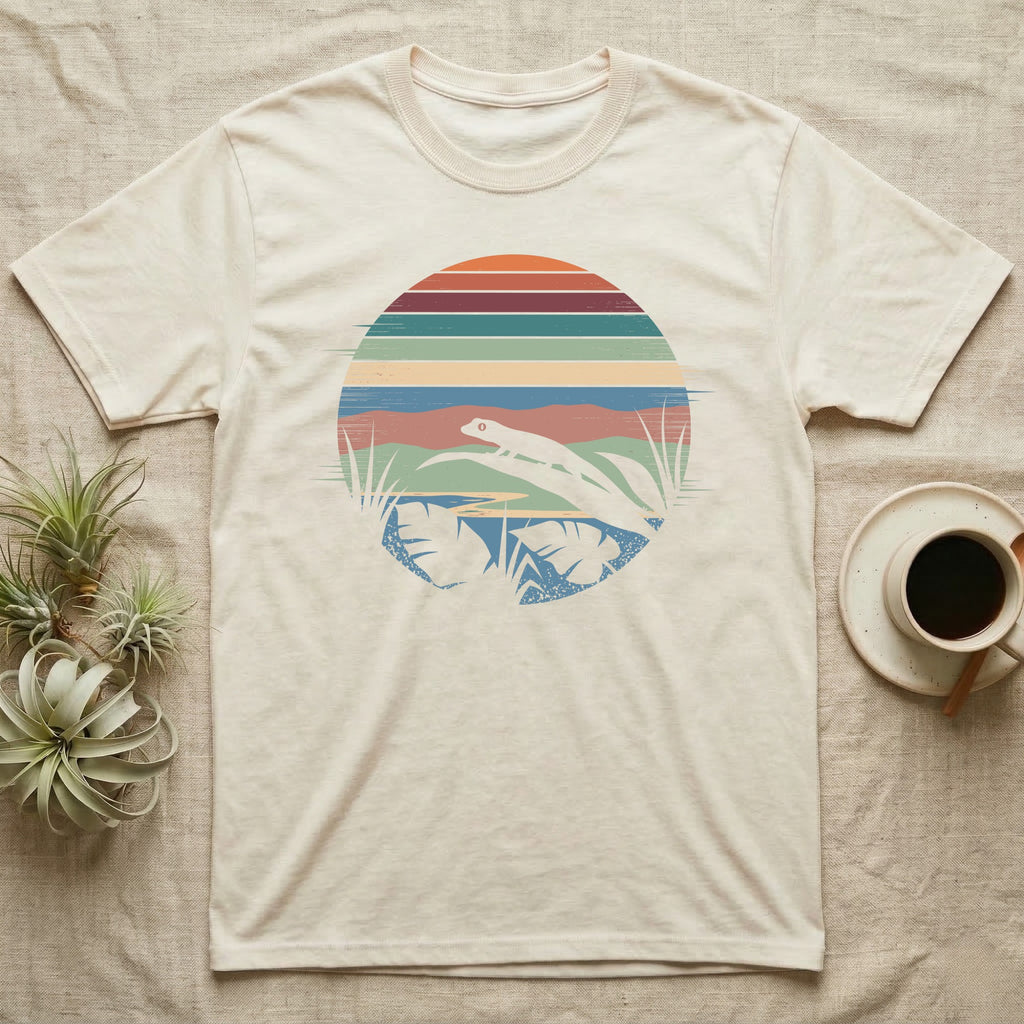 Mourning Gecko Window T-Shirt in Natural — Mourning gecko silhouetted on a leaf inside a broken circular window of flat stepped rainforest colour bands.