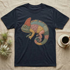 T-shirt with a colorful patchwork chameleon graphic on a dark blue background.