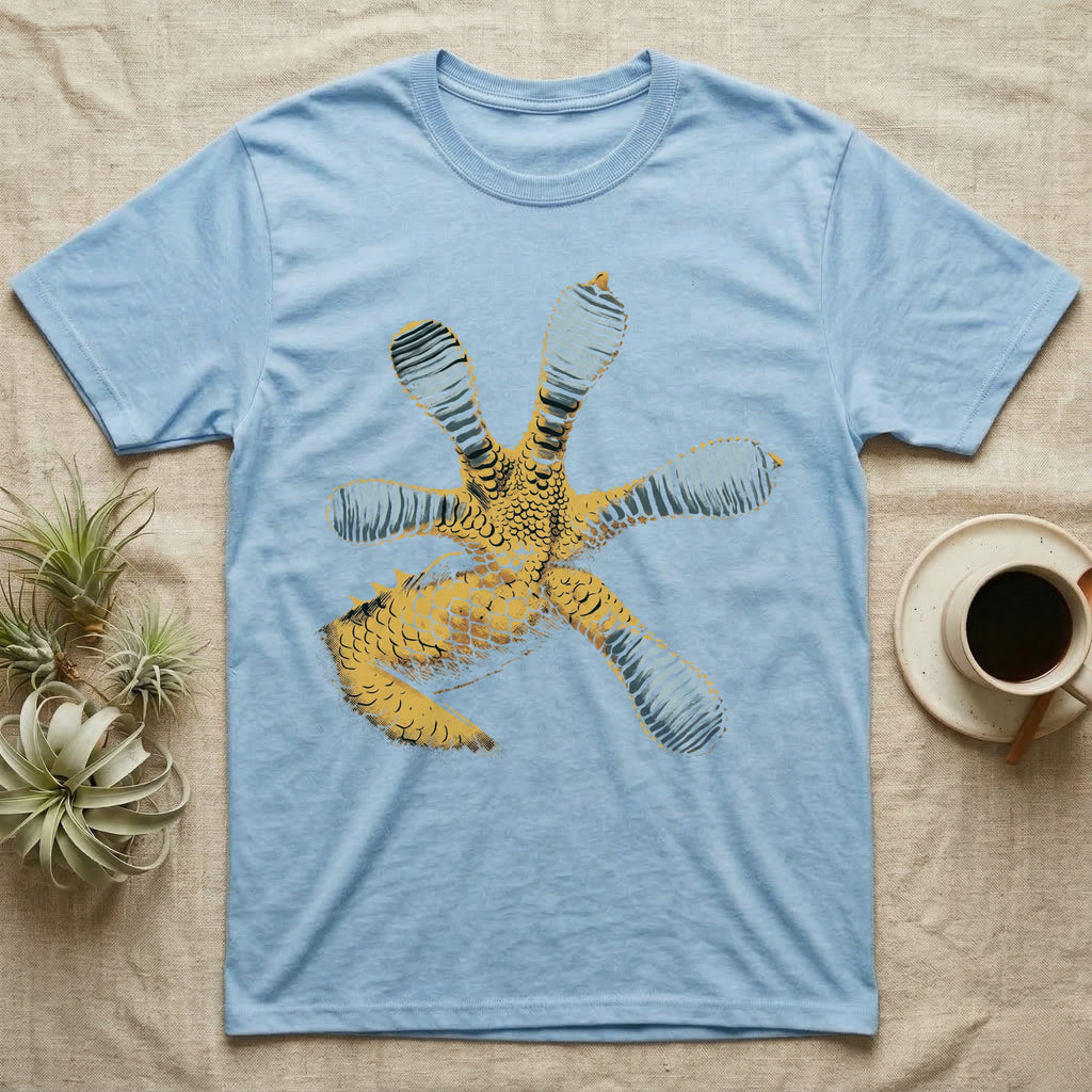 Macro illustration of a gecko's forefoot from underneath, ribbed blue-grey lamellae toe pads fanned against amber-gold scale texture, no on-shirt text. — shown on a Light Blue tee.