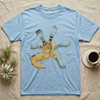 Macro illustration of a gecko's forefoot from underneath, ribbed blue-grey lamellae toe pads fanned against amber-gold scale texture, no on-shirt text. — shown on a Light Blue tee.