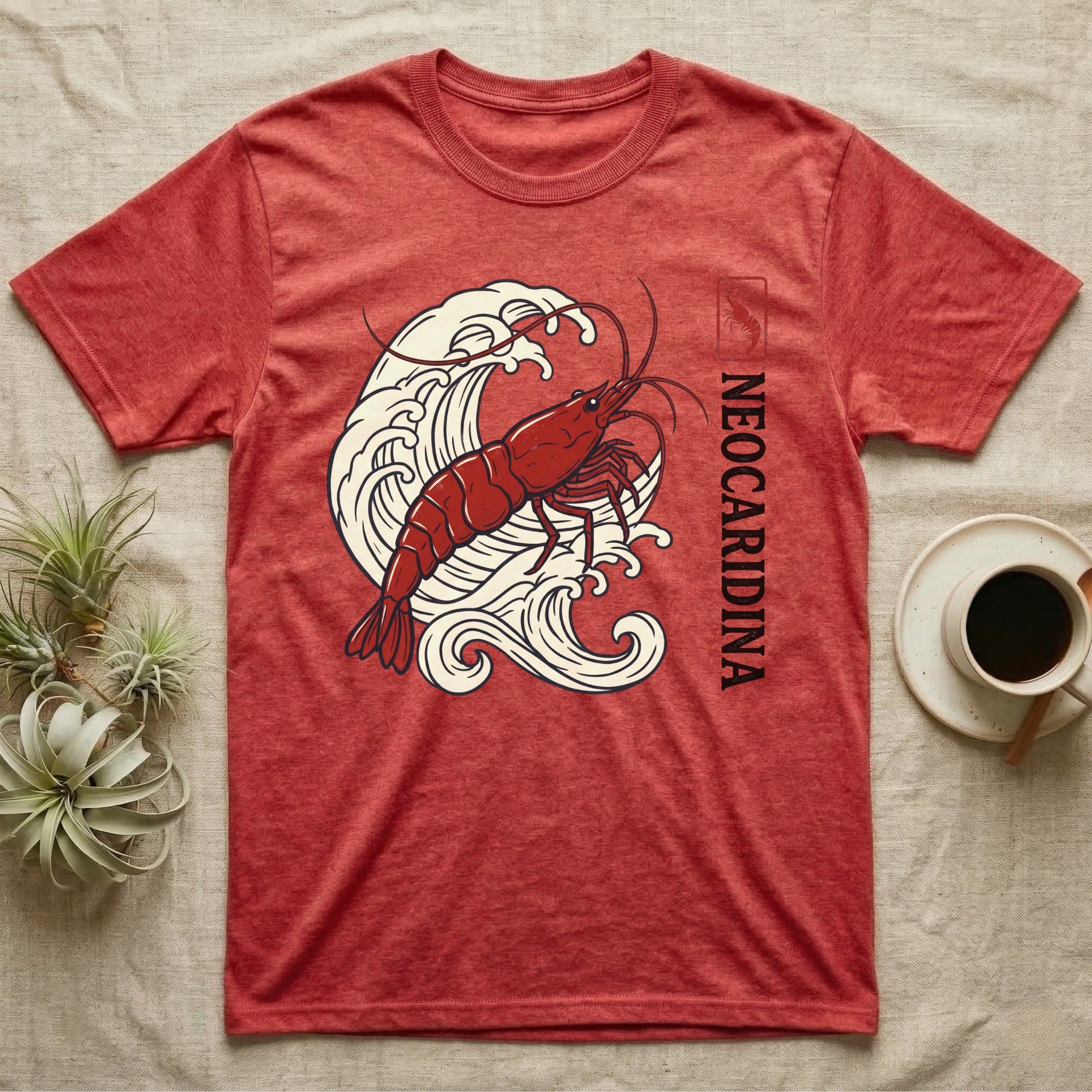 Red Neocaridina shrimp graphic on heather red t-shirt with waves.