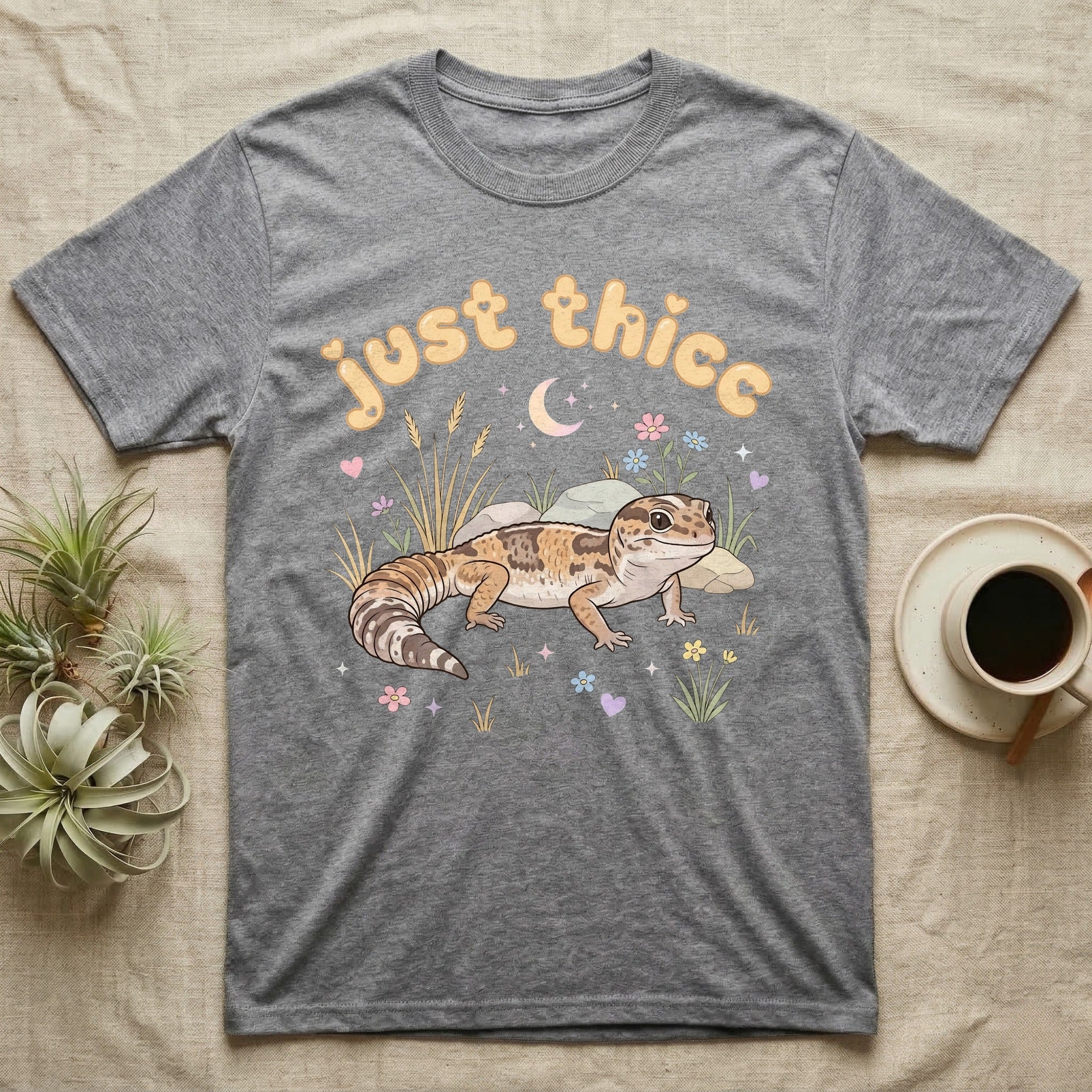 African Fat-Tailed Gecko Softie T-Shirt in Sport Grey — African fat-tailed gecko with a plump tail under a puffy pastel "just thicc" bubble wordmark with tiny hearts.