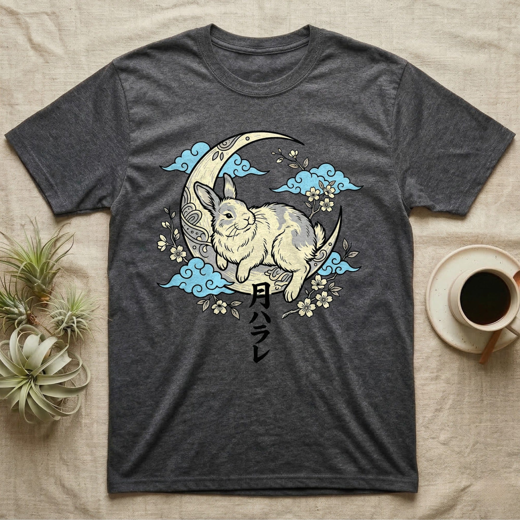 Dark grey t-shirt with a rabbit sitting on a crescent moon with Japanese text.
