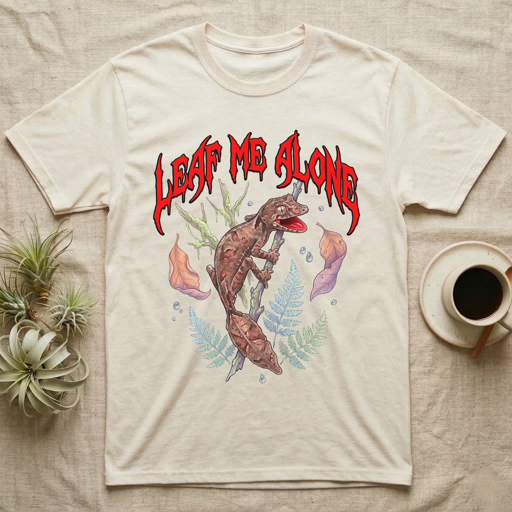 Satanic Leaf-Tailed Gecko Feral T-Shirt in Natural — Satanic leaf-tailed gecko gaping on a twig with dripping blood-red metal "Leaf Me Alone" wordmark above