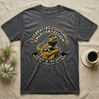 Bearded Dragon 1776 T-Shirt in Dark Heather — Bold woodcut tee of a bearded dragon in a tricorn hat black-bearding on a rock, gold and cream banner reading the lizards run the economy.