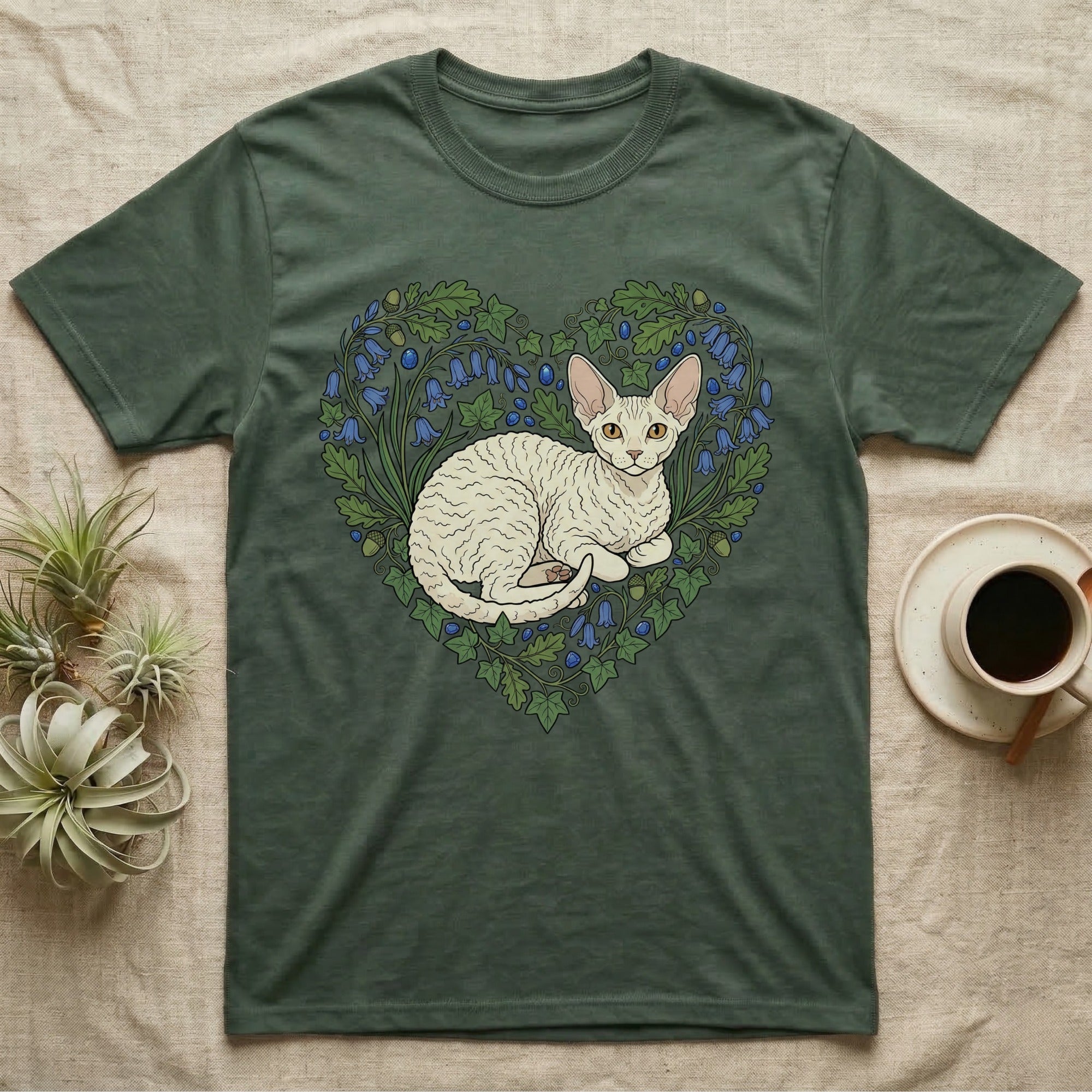 Cornish Rex cat illustration in a floral heart on a green t-shirt.