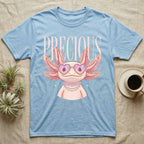 Light blue t-shirt with cartoon axolotl wearing heart-shaped sunglasses and text "PRECIOUS".