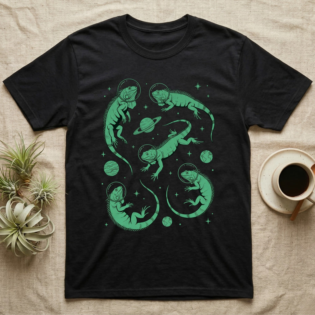 Green Iguana Cosmic T-Shirt in Black — Vintage screen-print illustration of green iguanas in astronaut helmets floating in space, cosmic emerald green monochromatic on dark background.