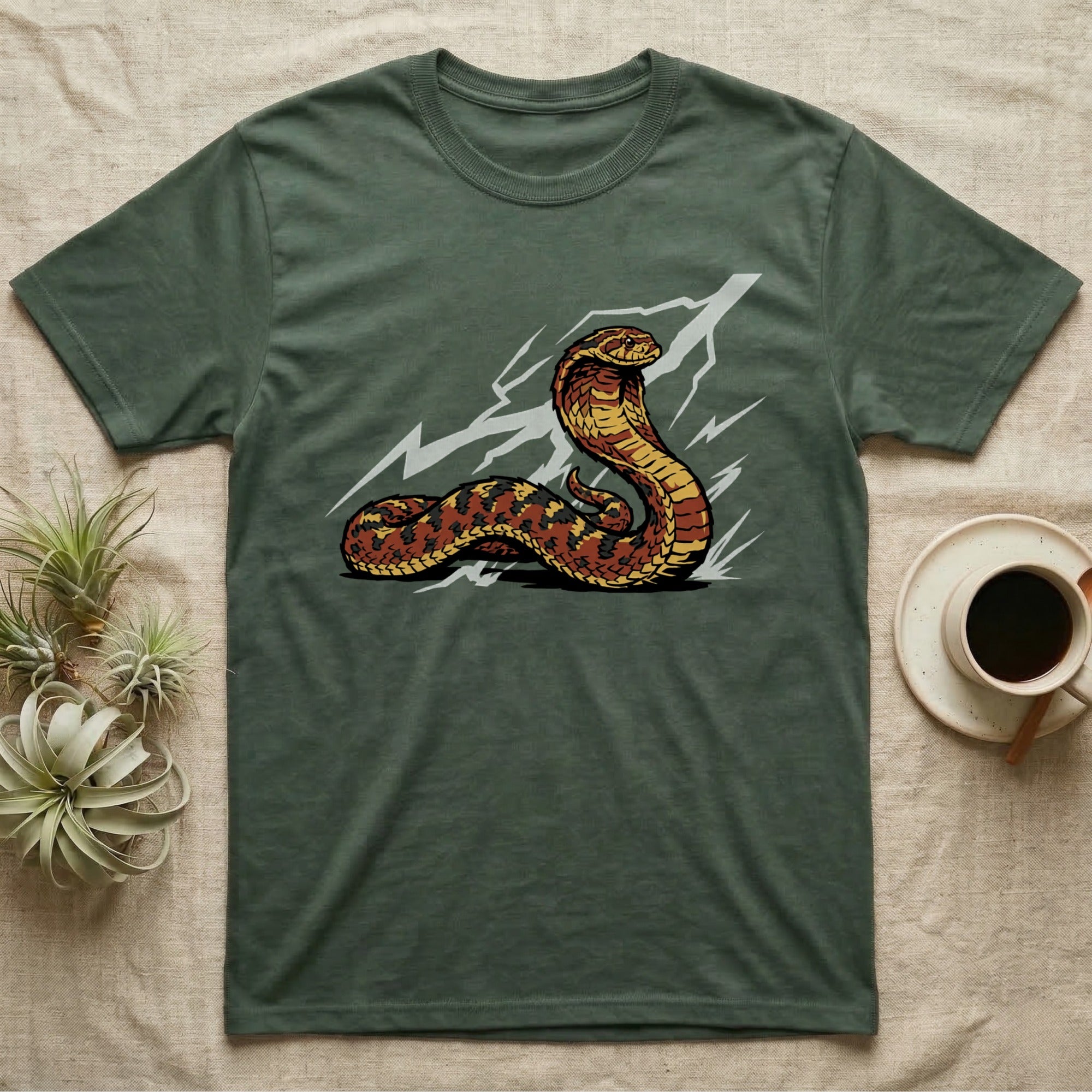 Green t-shirt with cobra and lightning bolt design.