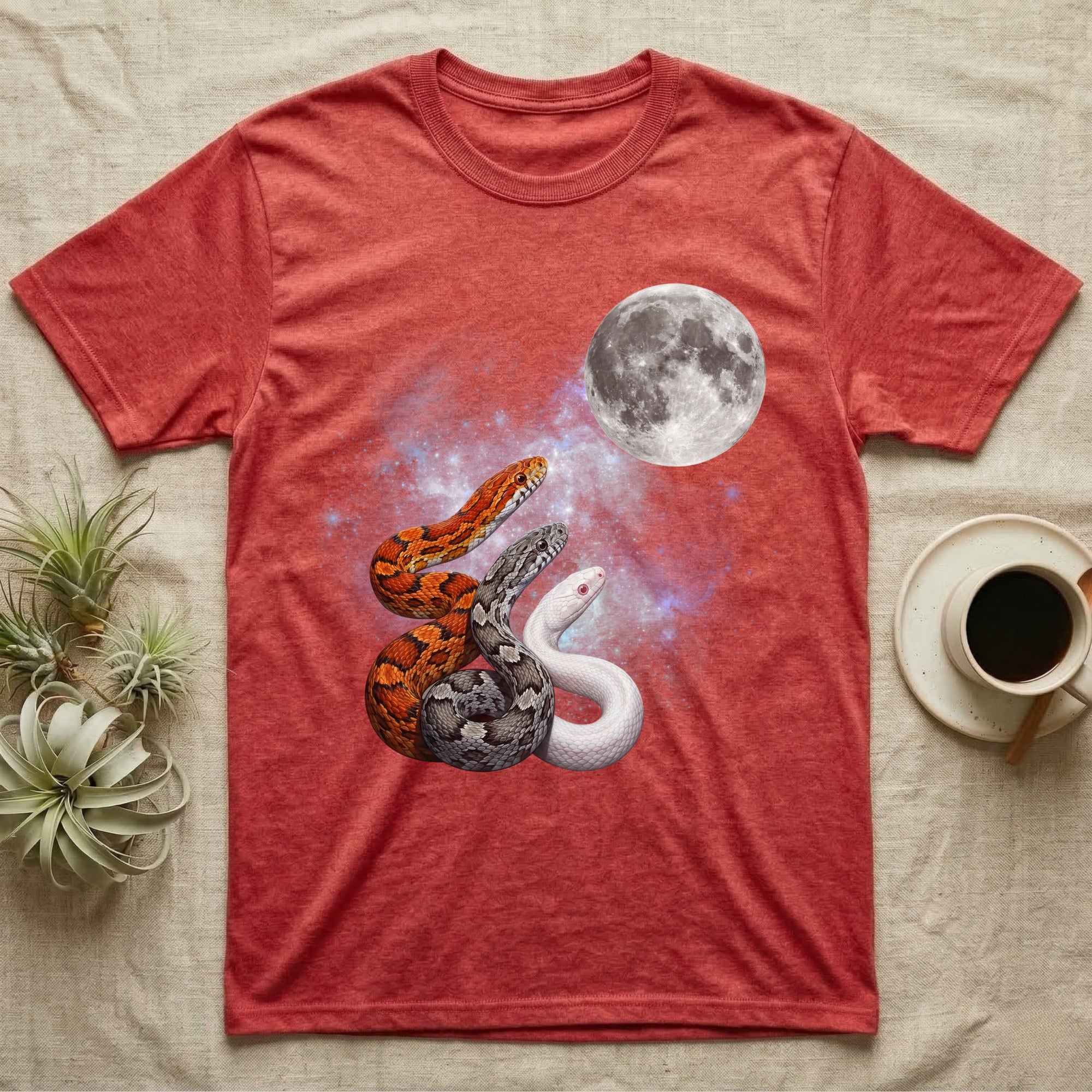 Corn Snake Moon Howl T-Shirt in Heather Red — Three Corn Snake colour morphs howling at a full moon over a nebula on a dark grey t-shirt.