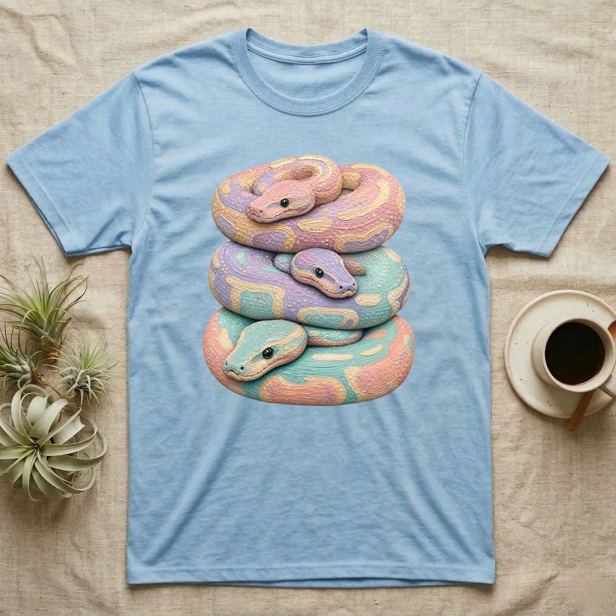 Light blue t-shirt with stacked pastel snakes design.