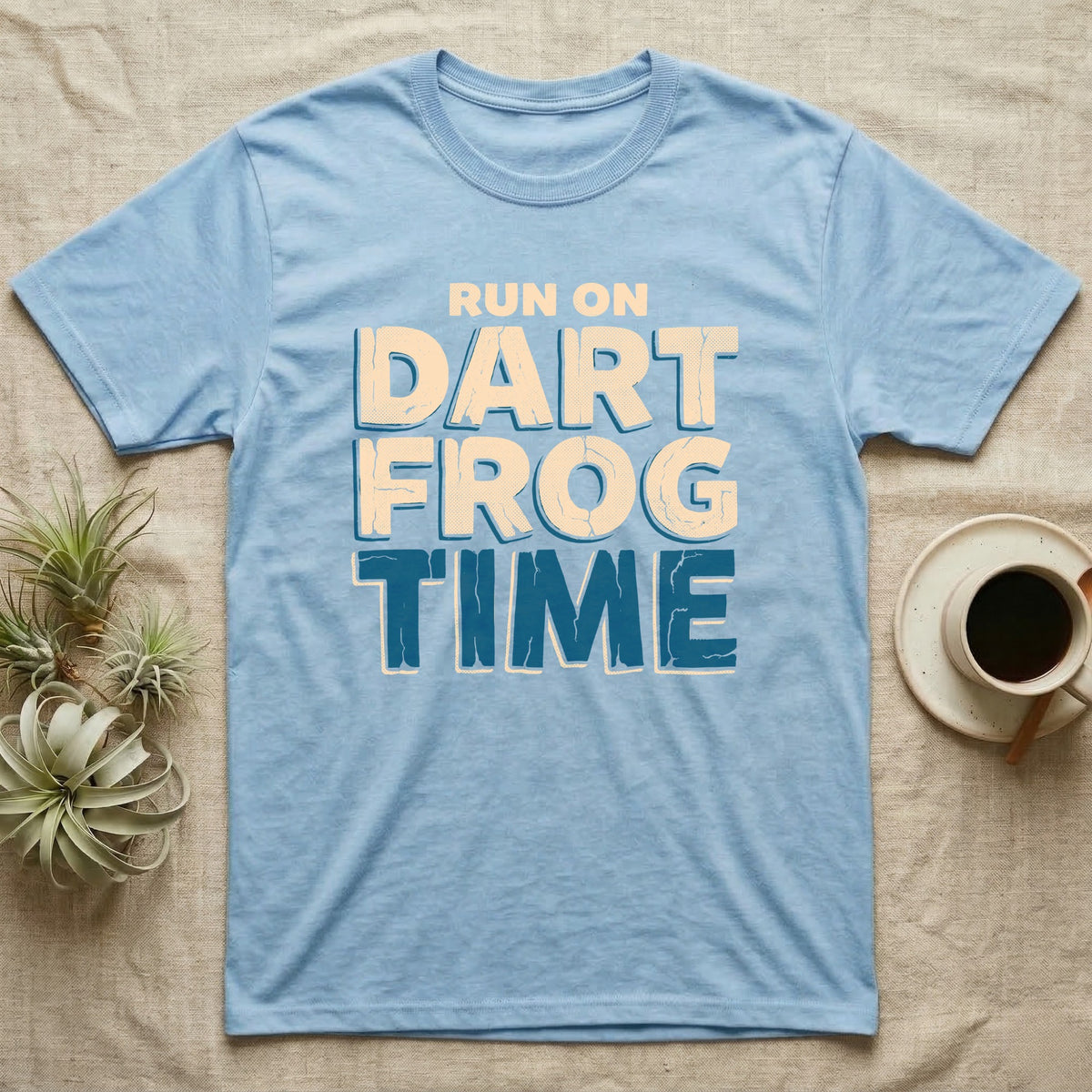 Dart Frog Time T-Shirt in Light Blue — Distressed-block wordmark reading run on dart frog time in a bold two-tier chest lockup, text only.
