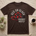 Milk Snake Friendly T-Shirt in Dark Chocolate — Worn screen-print of a red, black and cream banded milk snake under the cream words Red On Black, Friendly, Mostly