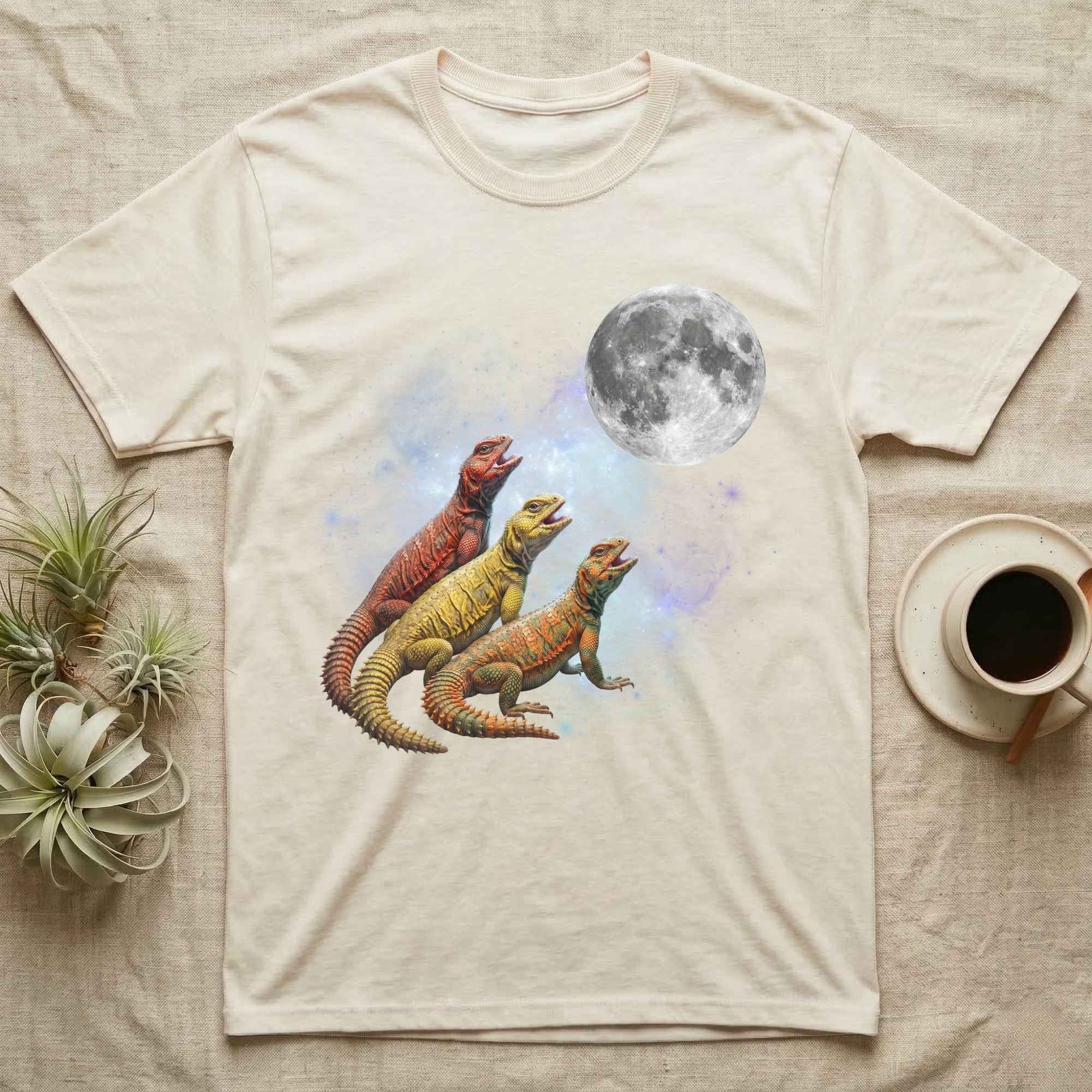 Uromastyx Moon Howl T-Shirt in Natural — Three Uromastyx colour morphs howling at a full moon over a nebula on a dark grey t-shirt.