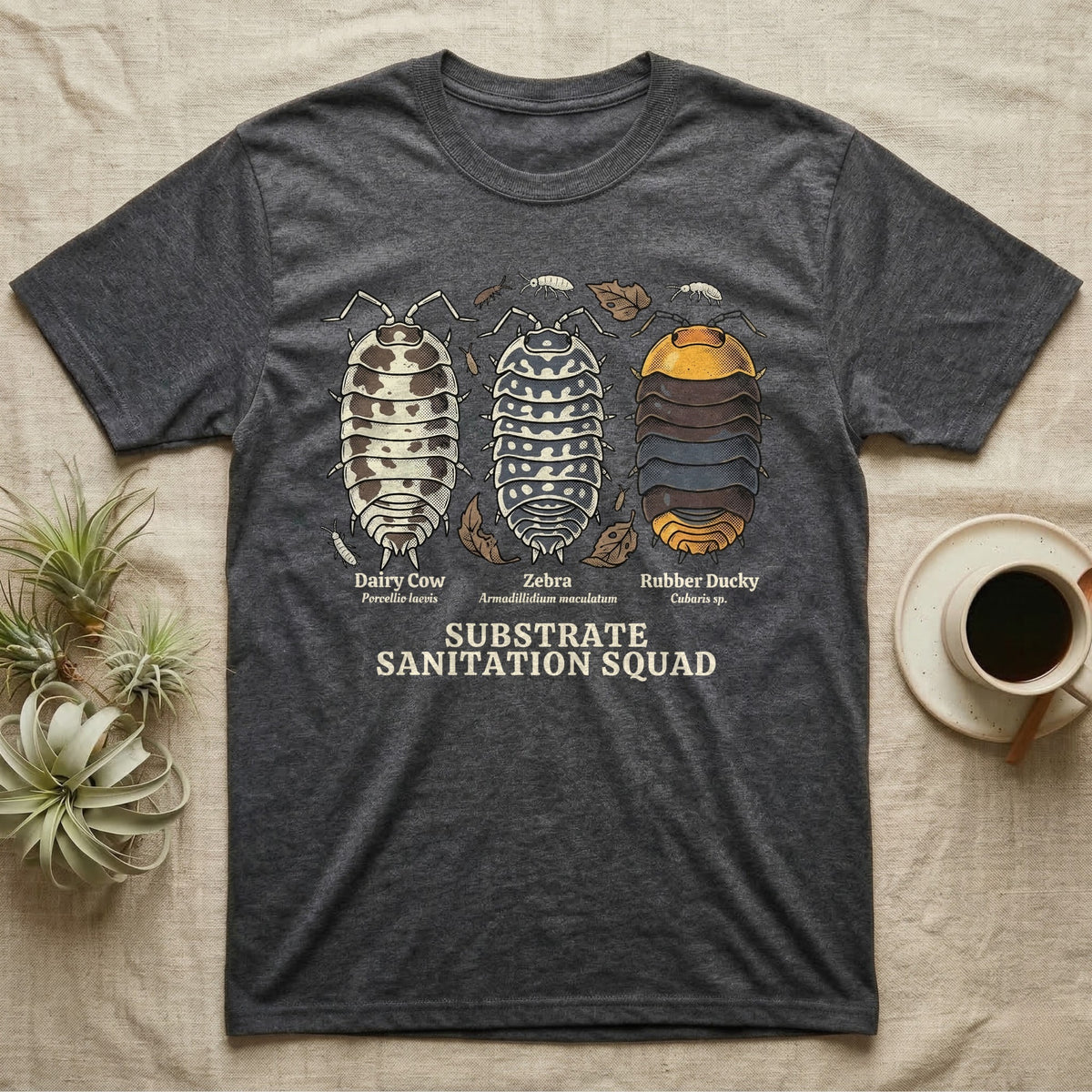 Isopod Substrate Sanitation Squad T-Shirt in Dark Heather — Engraved chart of dairy cow, zebra and rubber ducky isopods labelled with their scientific names.