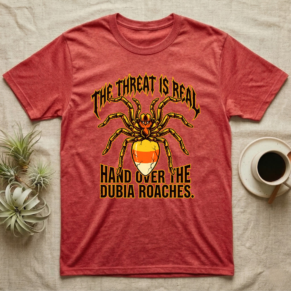 Tarantula Threat Dubia Roaches T-Shirt in Heather Red — Metal-style tarantula in threat posture with a candy-corn abdomen, "The Threat Is Real, Hand Over the Dubia Roaches."