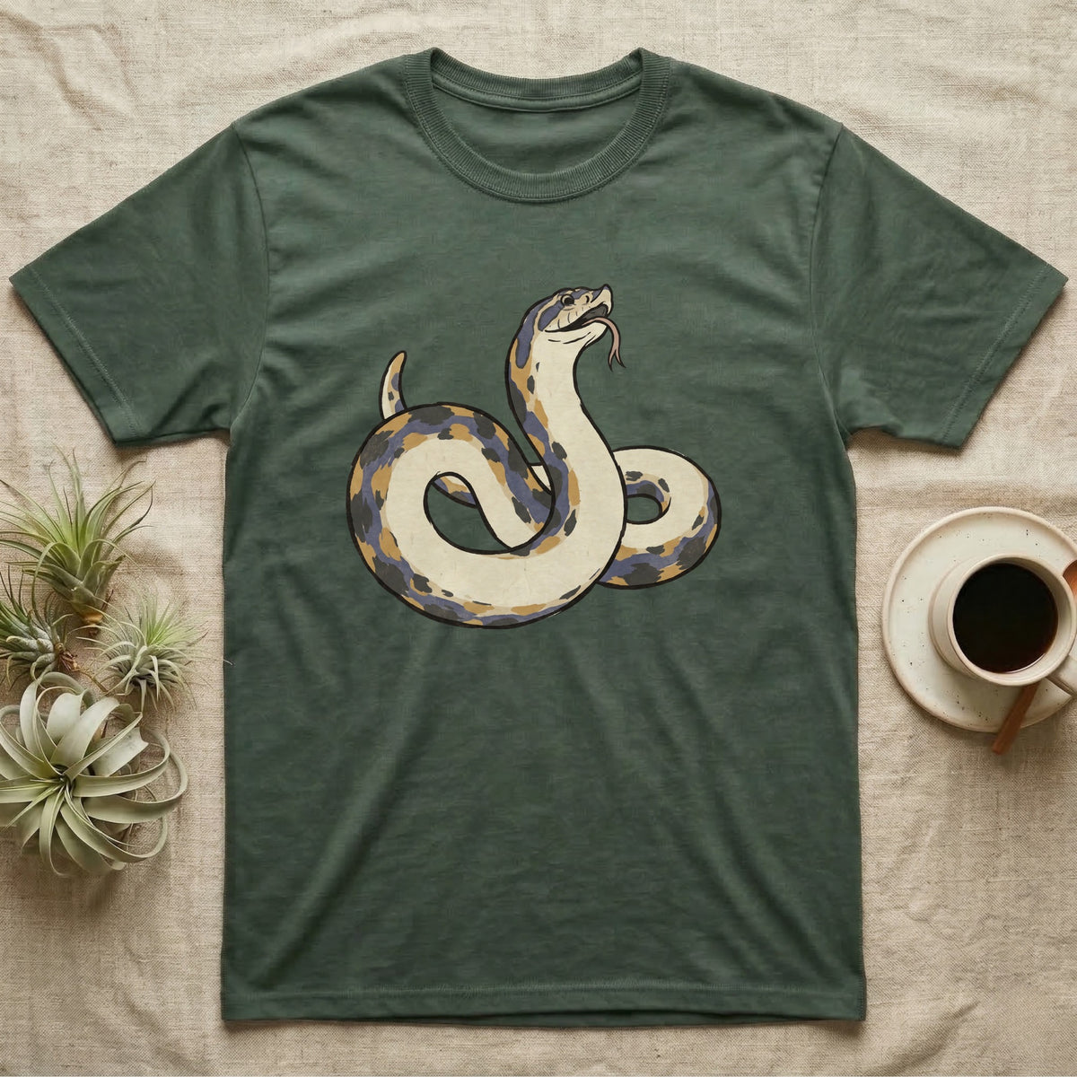 Hognose Play Dead T-Shirt in Military Green — Ukiyo-e woodblock illustration of a western hognose snake playing dead belly-up with a deadpan serif caption beneath.