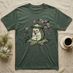 Green t-shirt with cartoon hedgehog wearing a straw hat, surrounded by cherry blossoms.