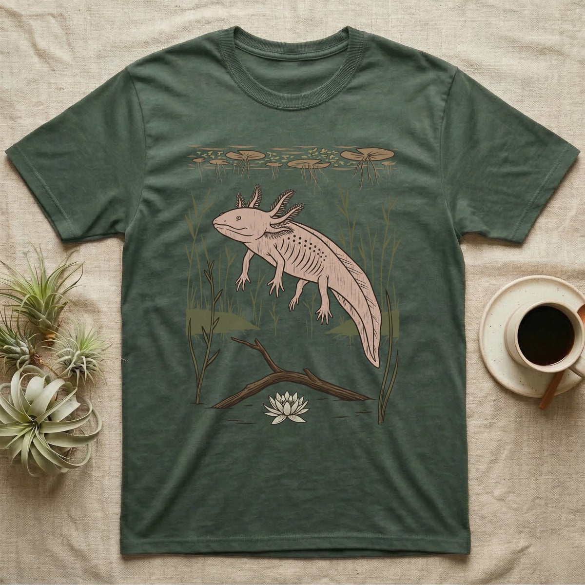 Axolotl Home Range T-Shirt in Military Green — Woodcut-style illustration of an axolotl drifting among reeds and lily pads in a Xochimilco canal, no on-shirt text.