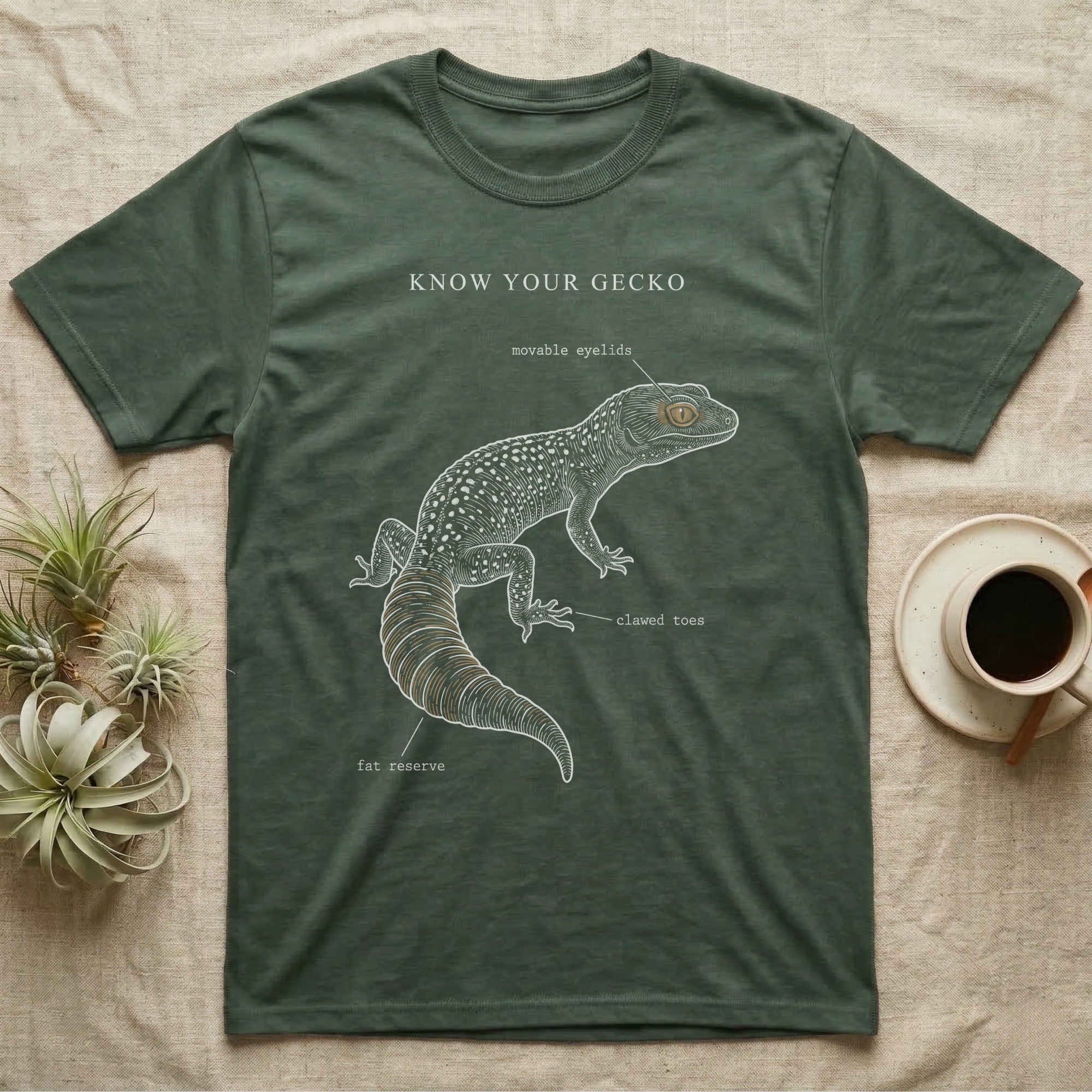 Leopard Gecko Anatomy T-Shirt in Military Green — One-ink leopard gecko specimen with "Know Your Gecko" header and handwritten labels for eyelids, tail, toes.