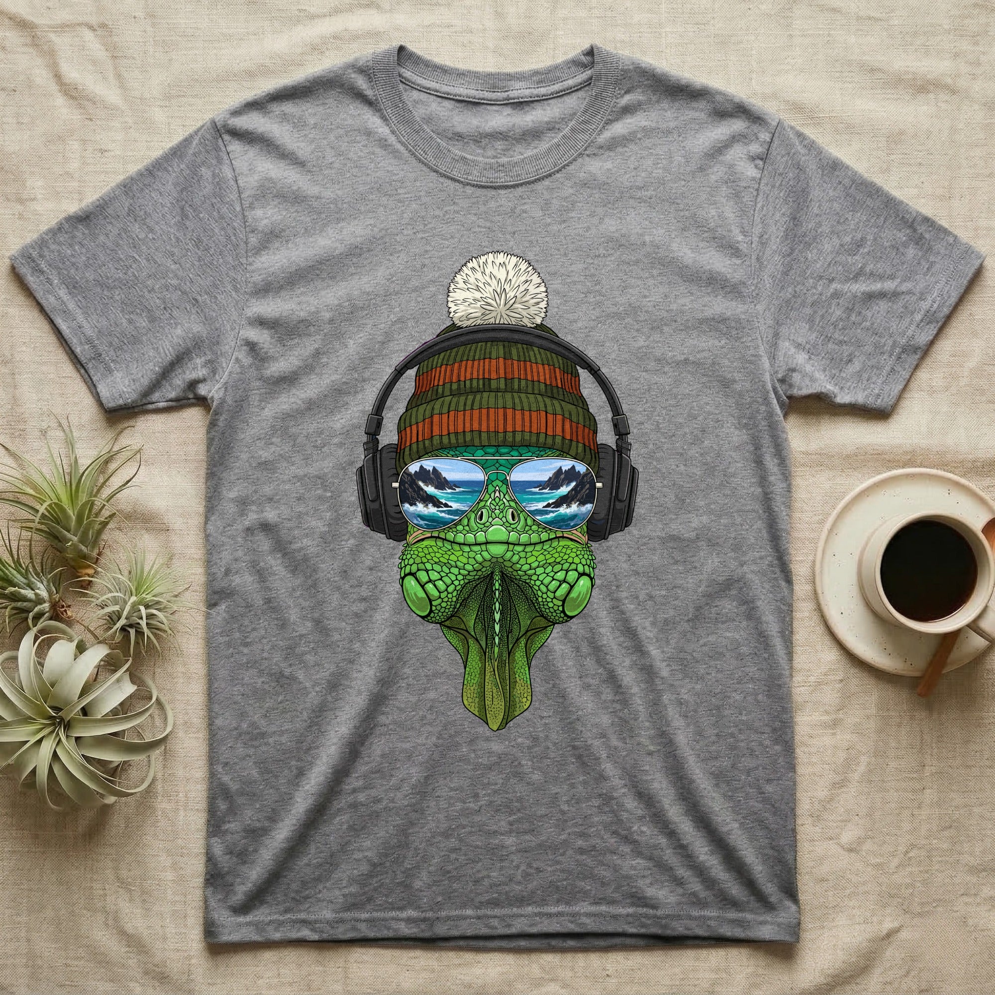 T-shirt with a green dinosaur wearing headphones, sunglasses, and a beanie.