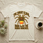 Tarantula Threat Dubia Roaches T-Shirt in Natural — Metal-style tarantula in threat posture with a candy-corn abdomen, "The Threat Is Real, Hand Over the Dubia Roaches."